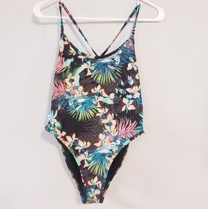 One piece swimsuit. Tropical pattern.